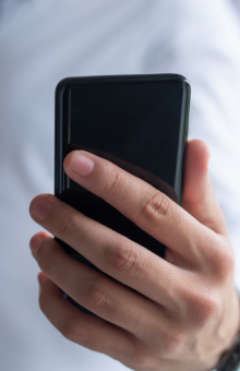 closeup business man holding smart phone